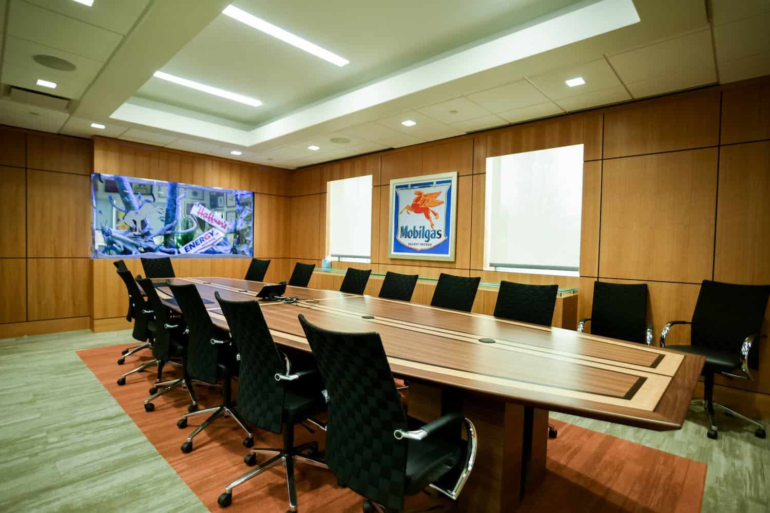 Premium corporate boardroom in India featuring ergonomic seating, smart lighting, and cutting-edge presentation technology for C-level meetings.